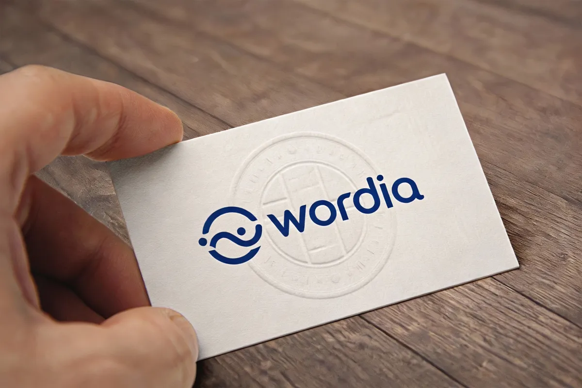 Mockup showing a wordmark logo on business cards — type: photo